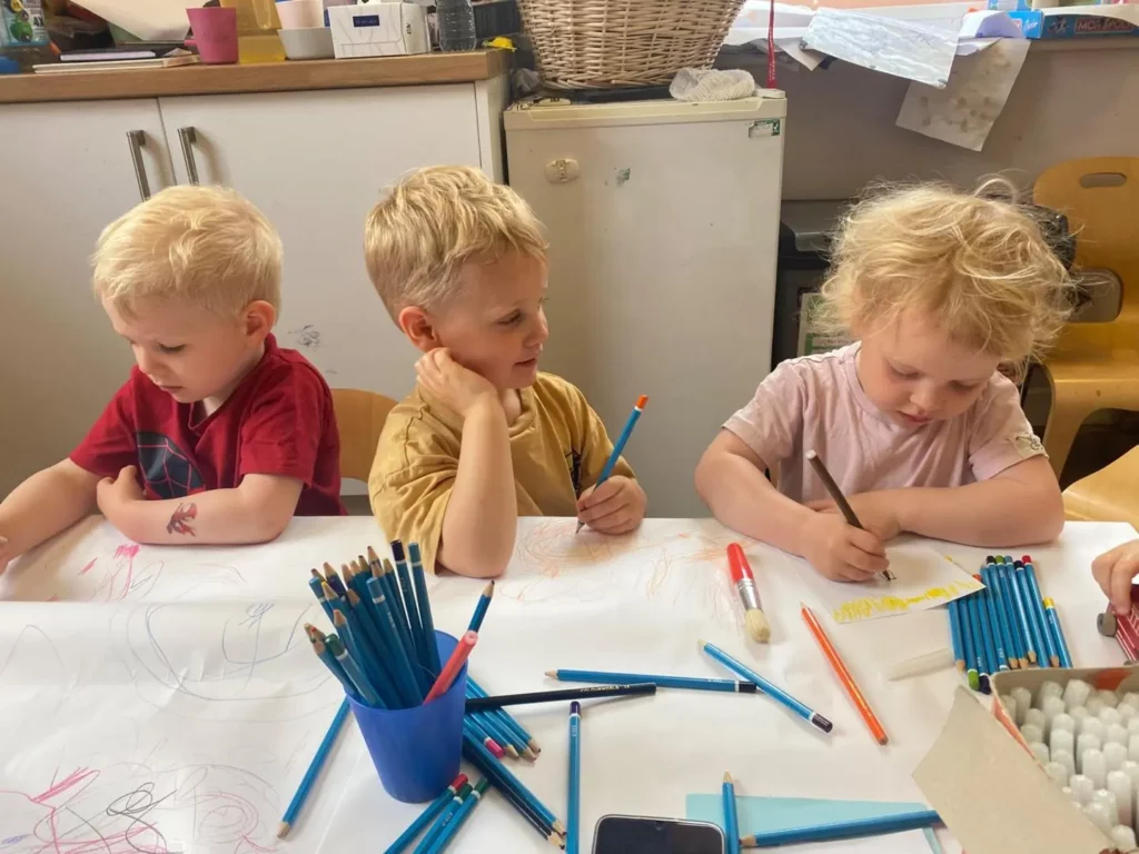 Children drawing and chatting