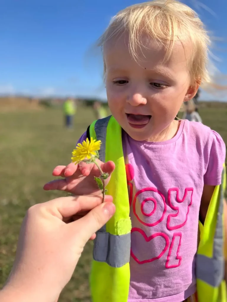 A child holding a flower