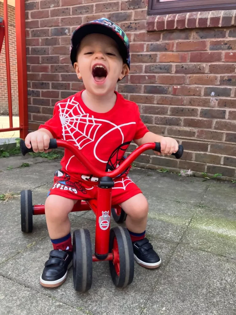 A child on a tricycle