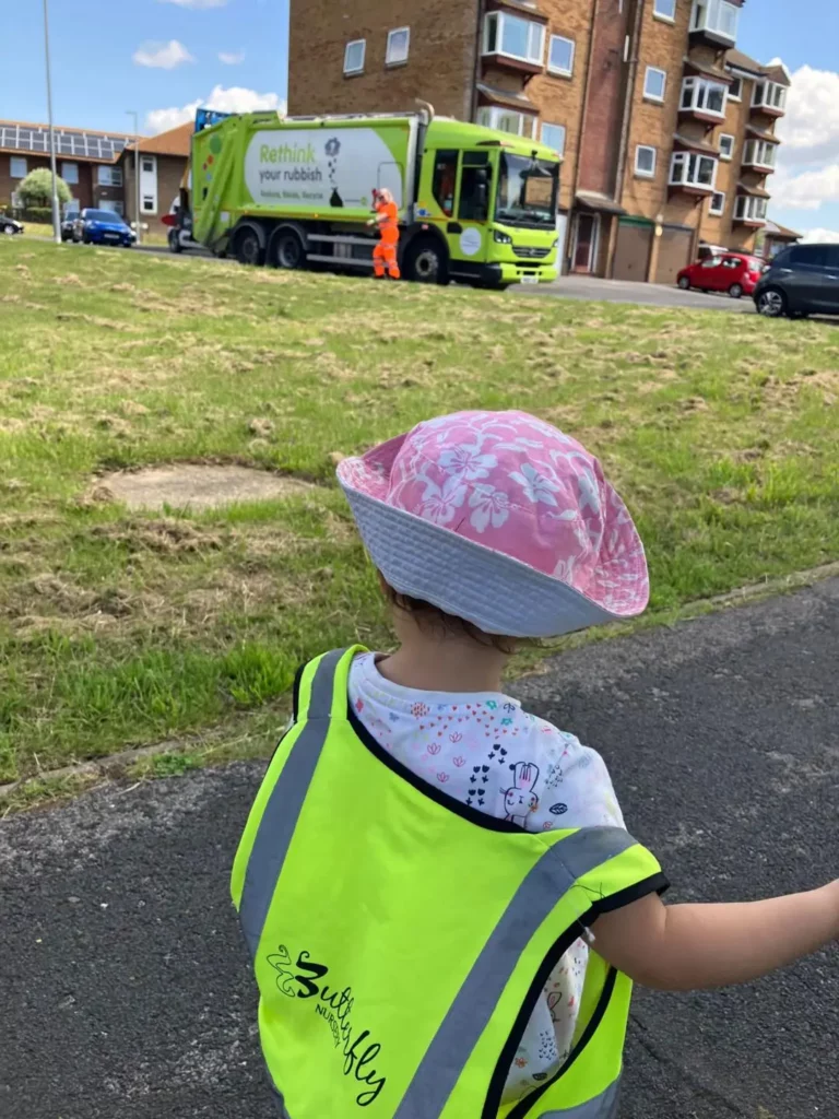 A child outside looking at the outside world