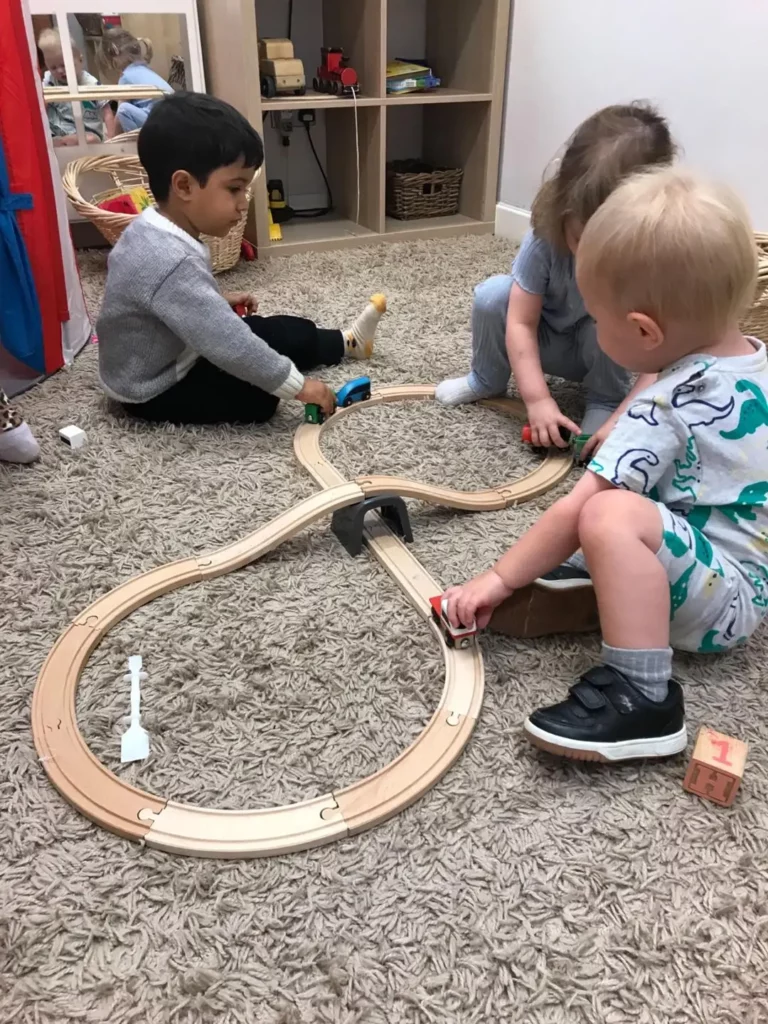 Children playing with a train set